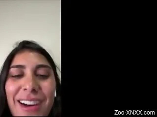 Brunette hottie feels aroused when watching online zoo porn